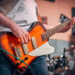 How to hold a bass guitar